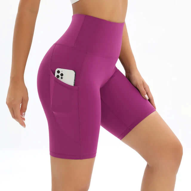 Comfortable women's yoga shorts, high-waisted with a phone pocket, great for studio & outdoor activities.