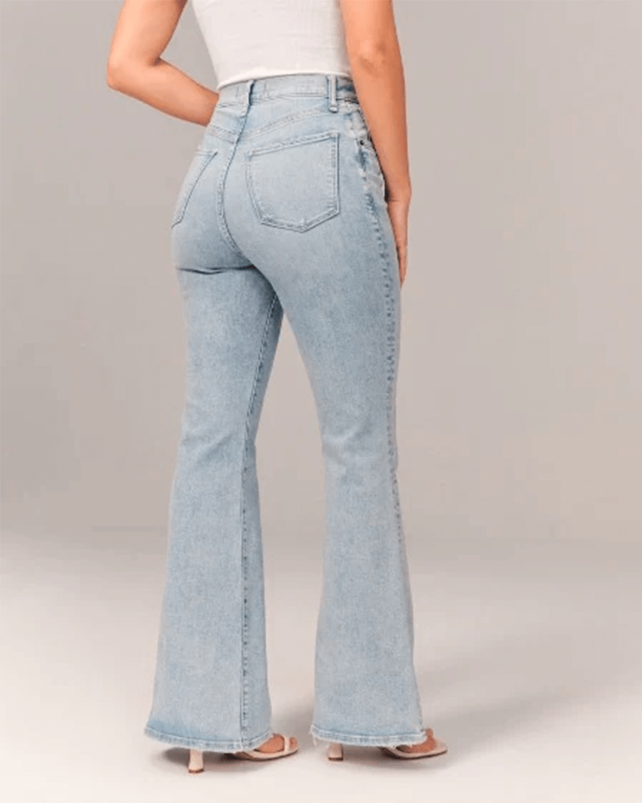 Blue stretch denim women's jeans with a high waist and stylish flare, offering comfort and vintage appeal.