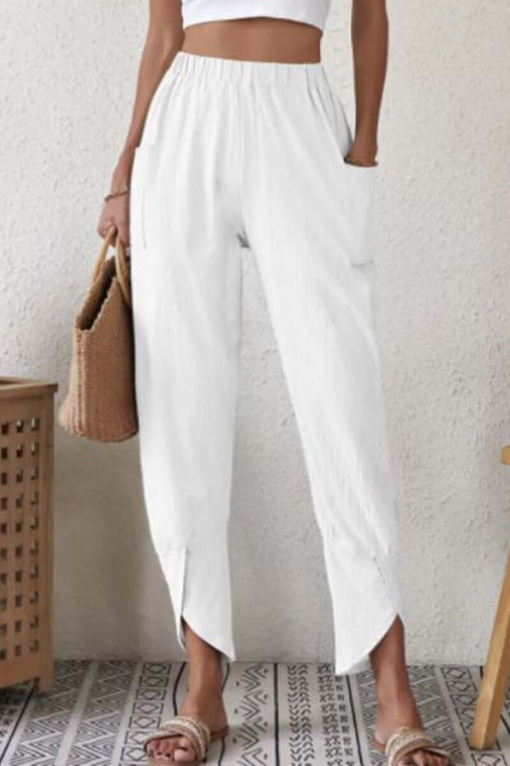Versatile women's high-waisted Harlan pants. Soft cotton, loose fit offers stylish comfort for relaxed everyday fashion.