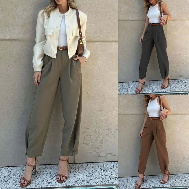 Women's high-waisted pleated cropped trousers in a neutral shade, perfect for casual chic or office wear.