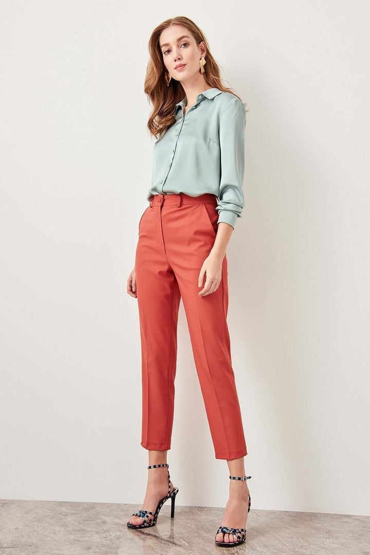 Stylish high-waisted relaxed fit women's trousers, offering comfort and a chic look for casual wear.
