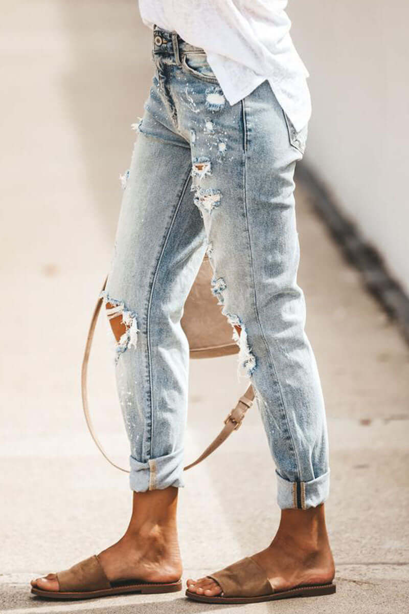 Comfortable high-waisted women's jeans. Straight leg, ripped denim for a casual, fashion-forward look.