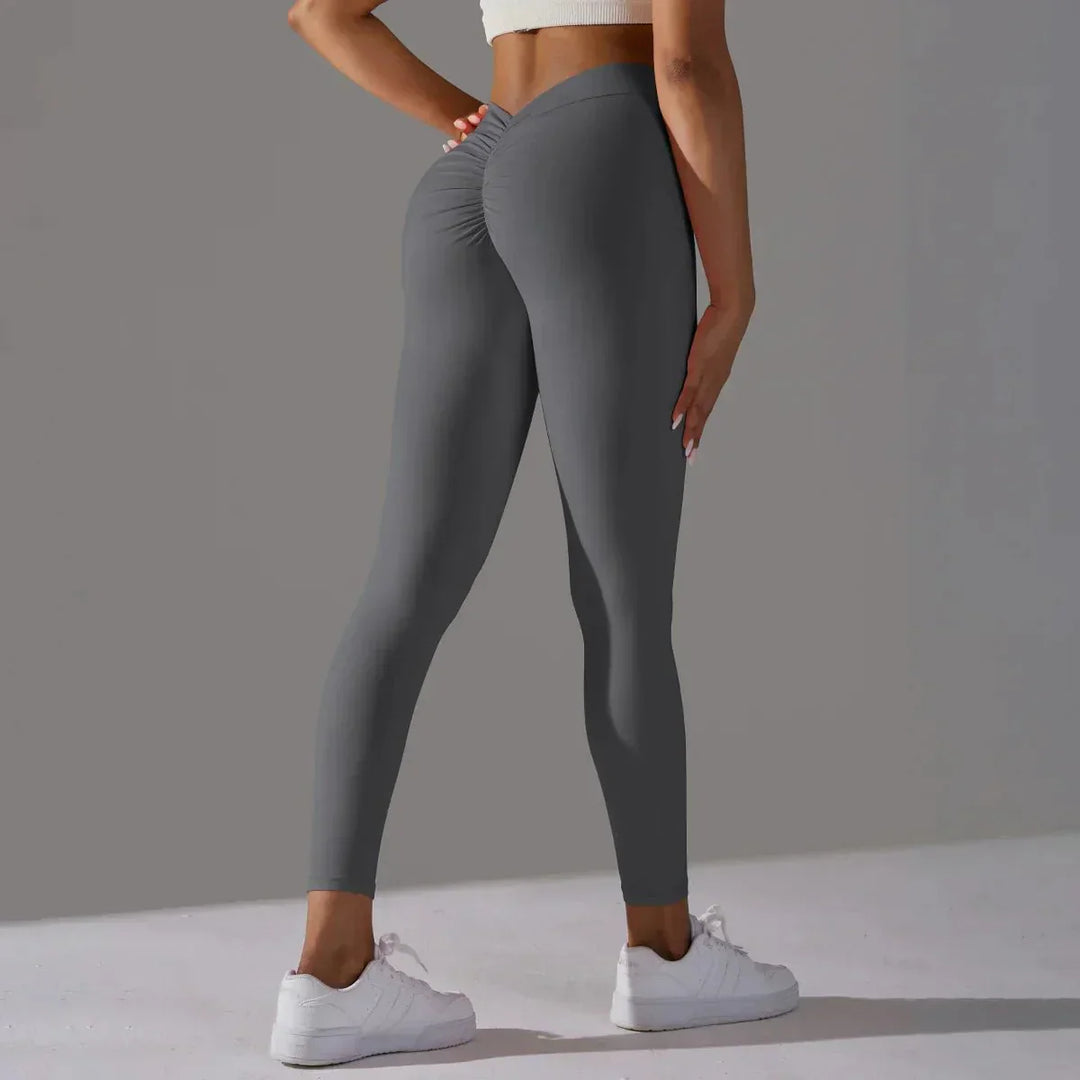 High-waisted women's scrunch leggings, providing a sculpted fit for gym, yoga, & active wear.
