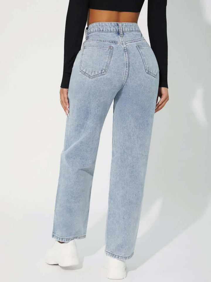 Model wearing women's high-waisted straight leg jeans in a chic dark wash, showcasing a comfortable silhouette.
