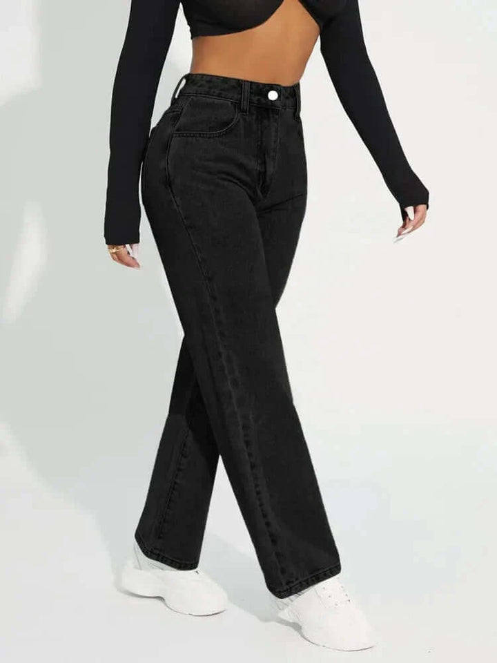 Women's straight leg high-waisted jeans in a medium wash, ideal casual denim pants for a flattering fit.