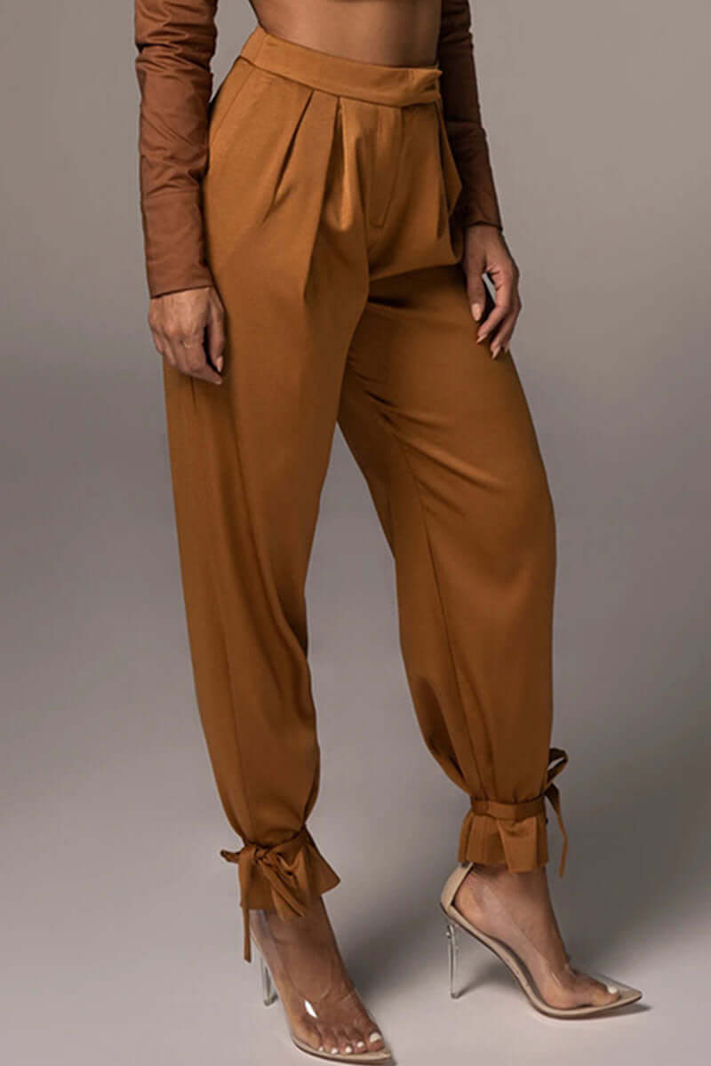 Women's high-waisted tapered trousers with elegant ankle ties, perfect for versatile fashion and comfort.