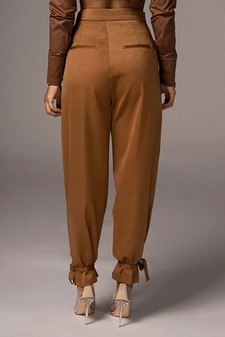 Comfortable & fashionable high-waisted tapered trousers for women, featuring chic ankle ties. Great for everyday.