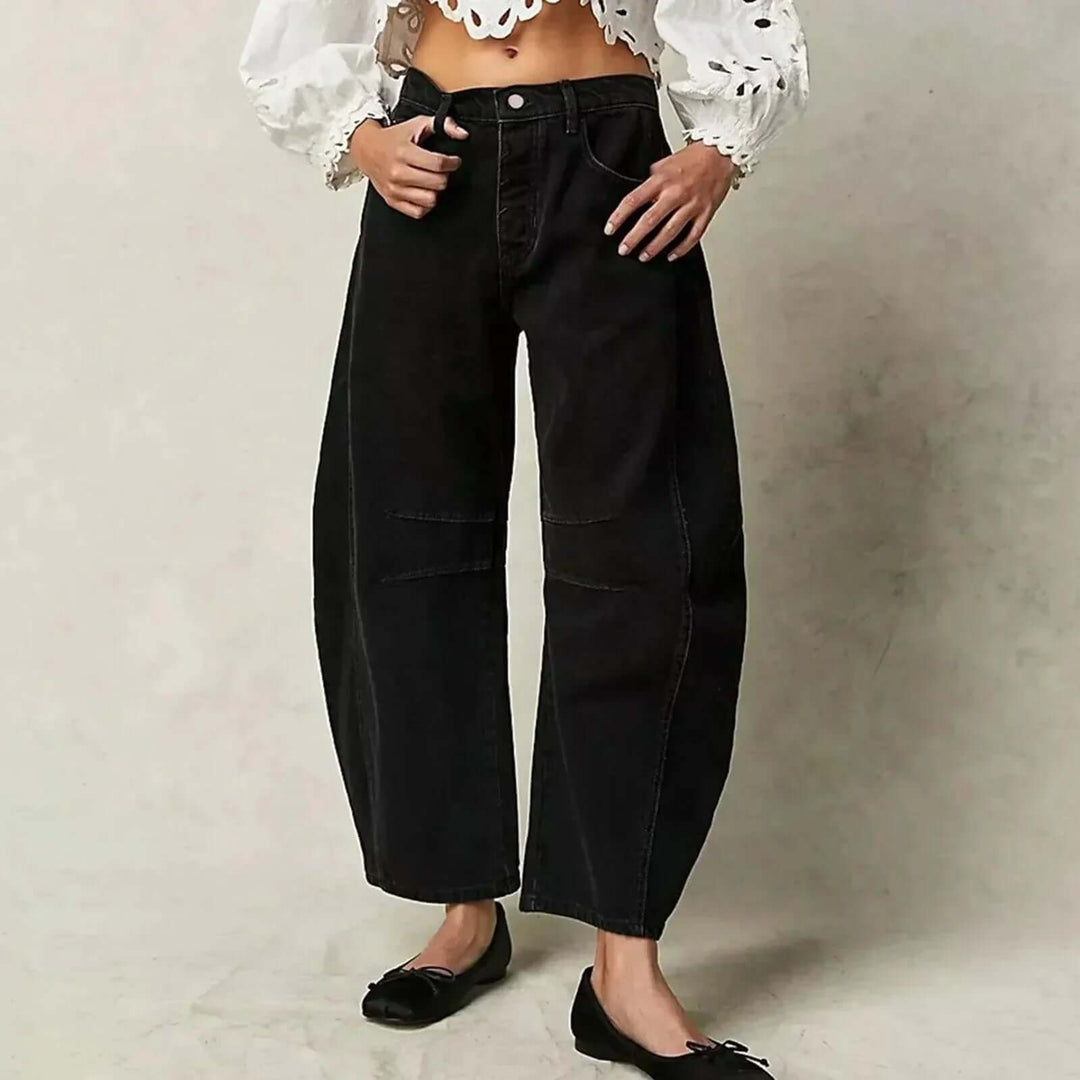 White high-waisted wide leg women's denim jeans, fashionable & comfortable for chic modern style.