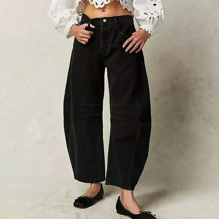 White high-waisted wide leg women's denim jeans, fashionable & comfortable for chic modern style.