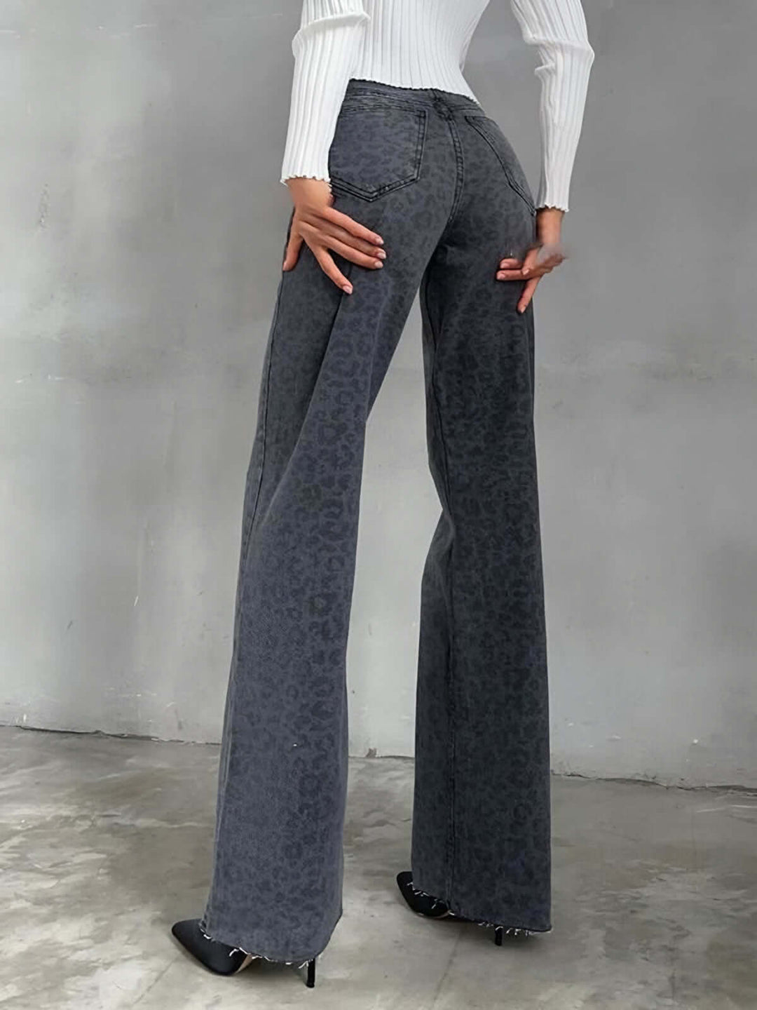 Stylish women's animal print wide leg denim jeans. High-waisted and featuring a bold leopard pattern.