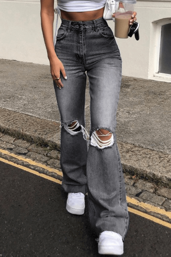 Trendy women's high-waisted wide leg ripped pants. Distressed denim for a fashionable casual look. Comfortable cotton.