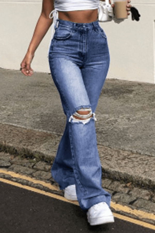 Fashionable women's high-waisted wide leg ripped jeans with a distressed finish. Ideal for a chic street style outfit.