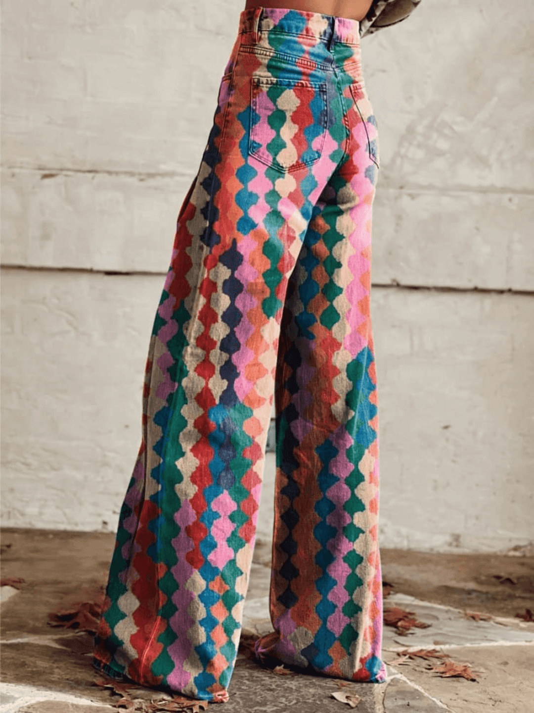 Stylish red wide-leg women's pants featuring a bold retro print, perfect for elegant or casual wear.