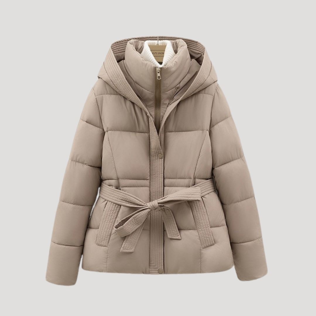Comfortable women's belted puffer jacket with hood. Designed for cozy cold weather protection.