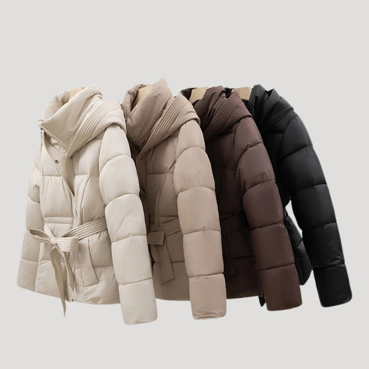Chic women's hooded puffer winter jacket. A stylish, warm, and practical belted coat for women.