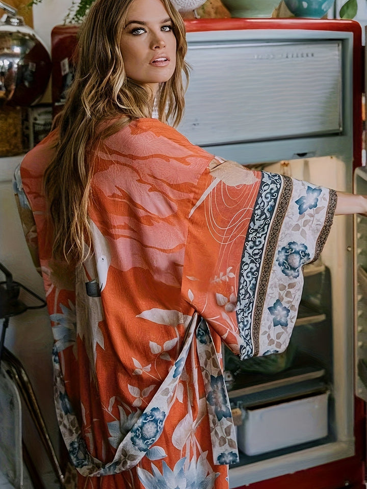 Lightweight women's red floral print kimono with open front & batwing sleeves, ideal for resort wear.