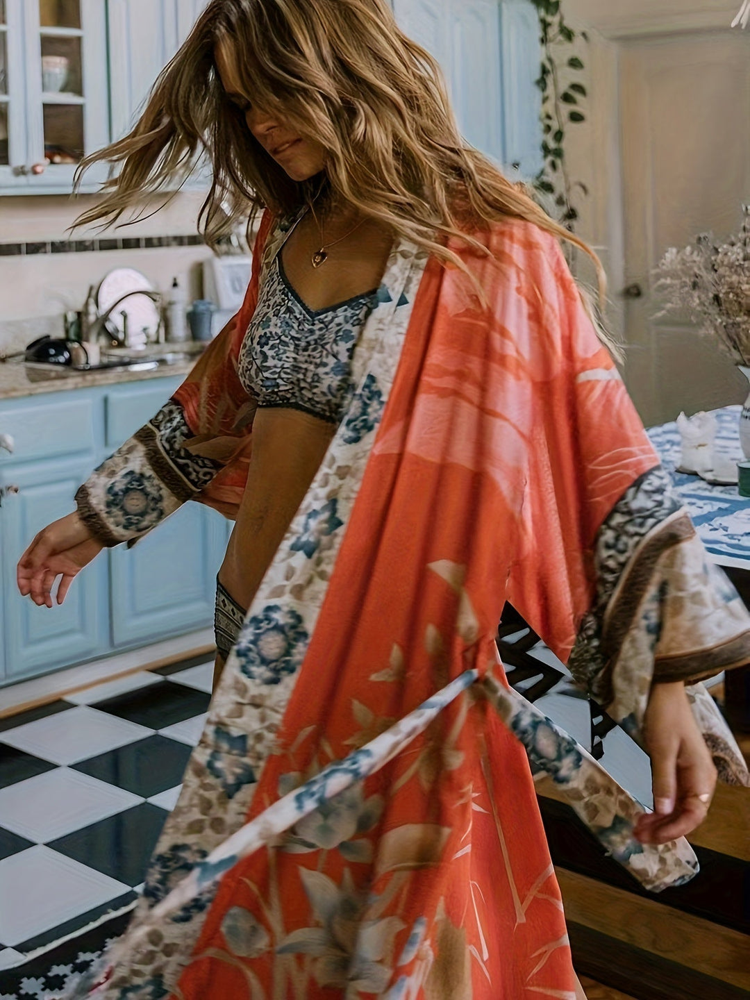 Effortless women's lightweight red floral kimono, a chic beach cover-up for relaxed summer fashion.