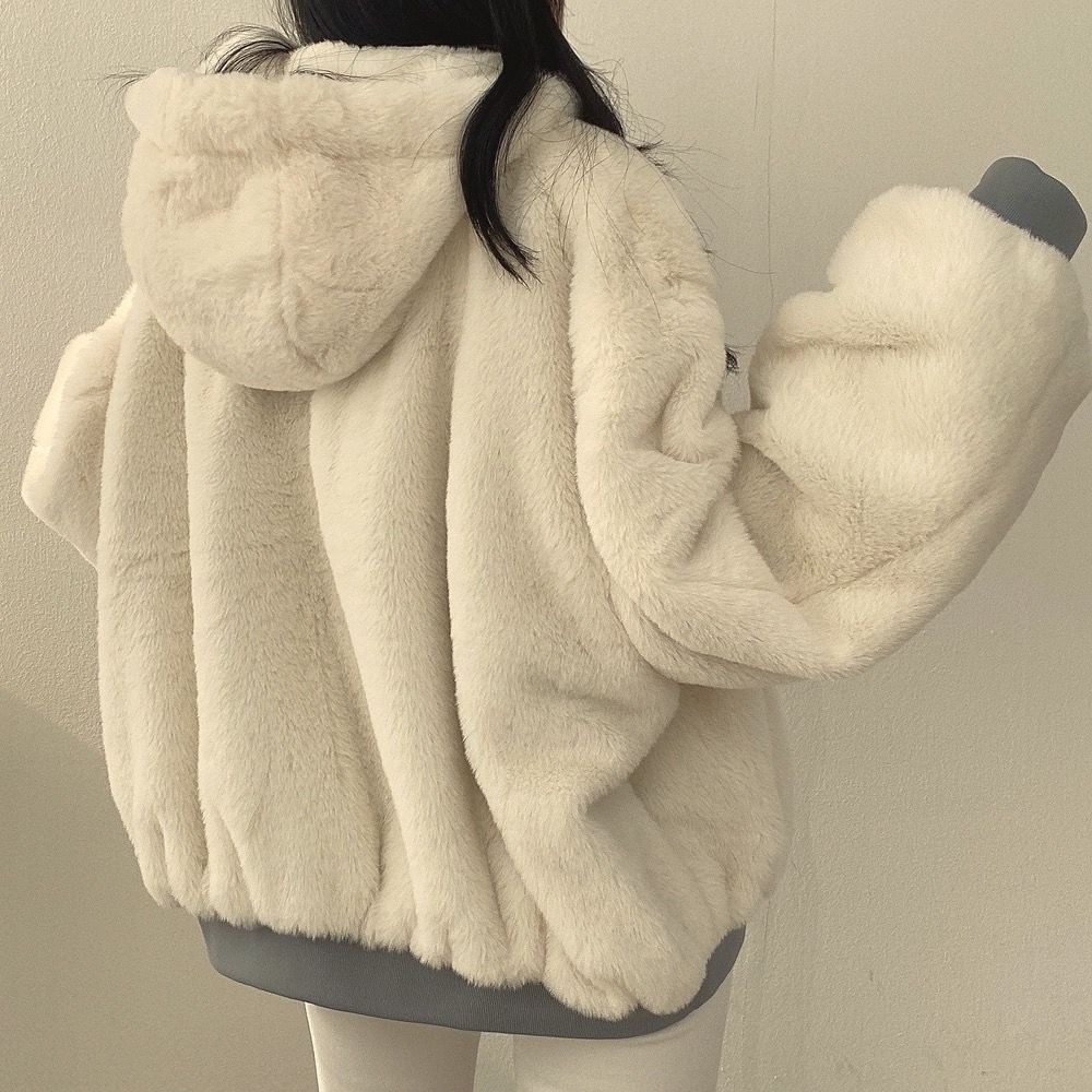 Full length: Women's warm reversible coat, essential for cold weather fashion.