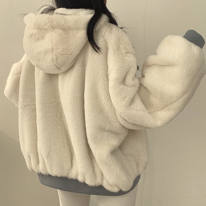 Full length: Women's warm reversible coat, essential for cold weather fashion.
