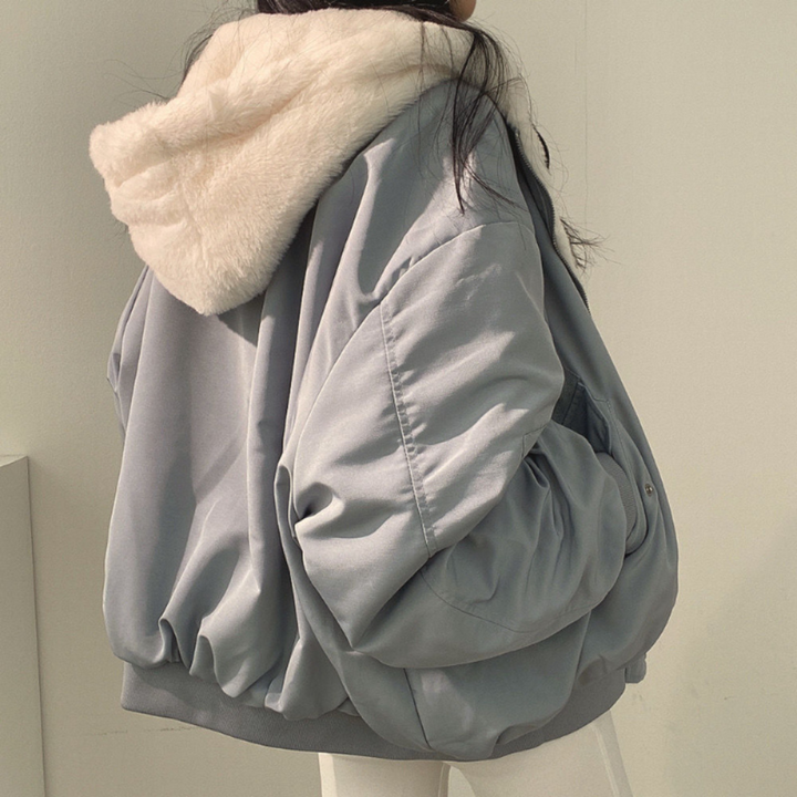 Warm women's reversible jacket with a hood, ideal for cold weather & casual wear.