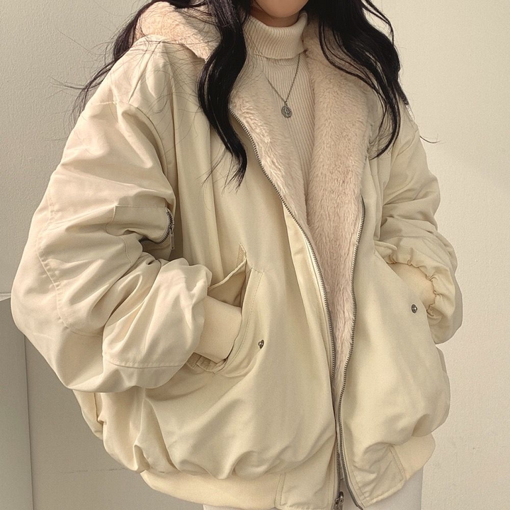 Women's reversible hooded jacket in contrasting colors, warm & stylish cold weather outerwear.