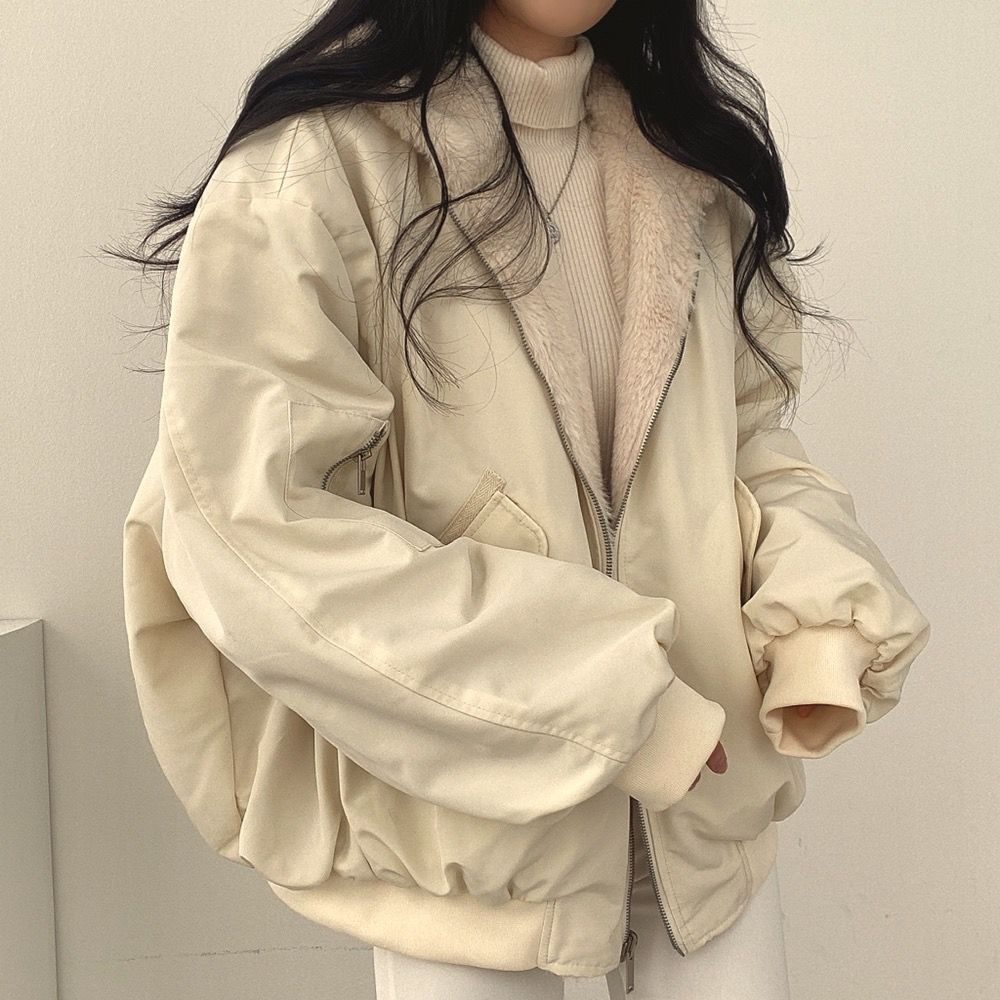 Side view of women's hooded reversible jacket, perfect for travel & fall winter style.