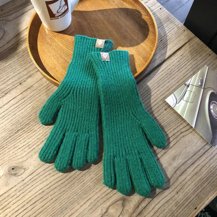 Cozy Isolde cotton gloves for women, keeping hands warm and enabling touchscreen device use in winter.
