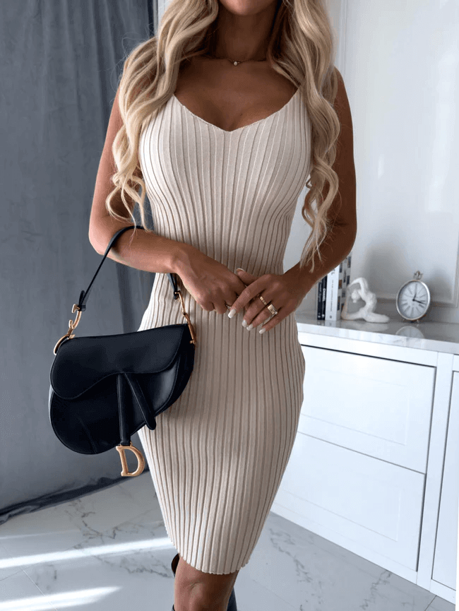 Women's knit sleeveless midi dress and matching sweater set. Comfortable two-piece outfit.