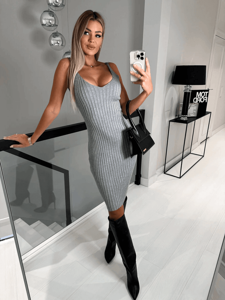 Stylish women's knit sweater and sleeveless dress set for versatile, comfortable wear.