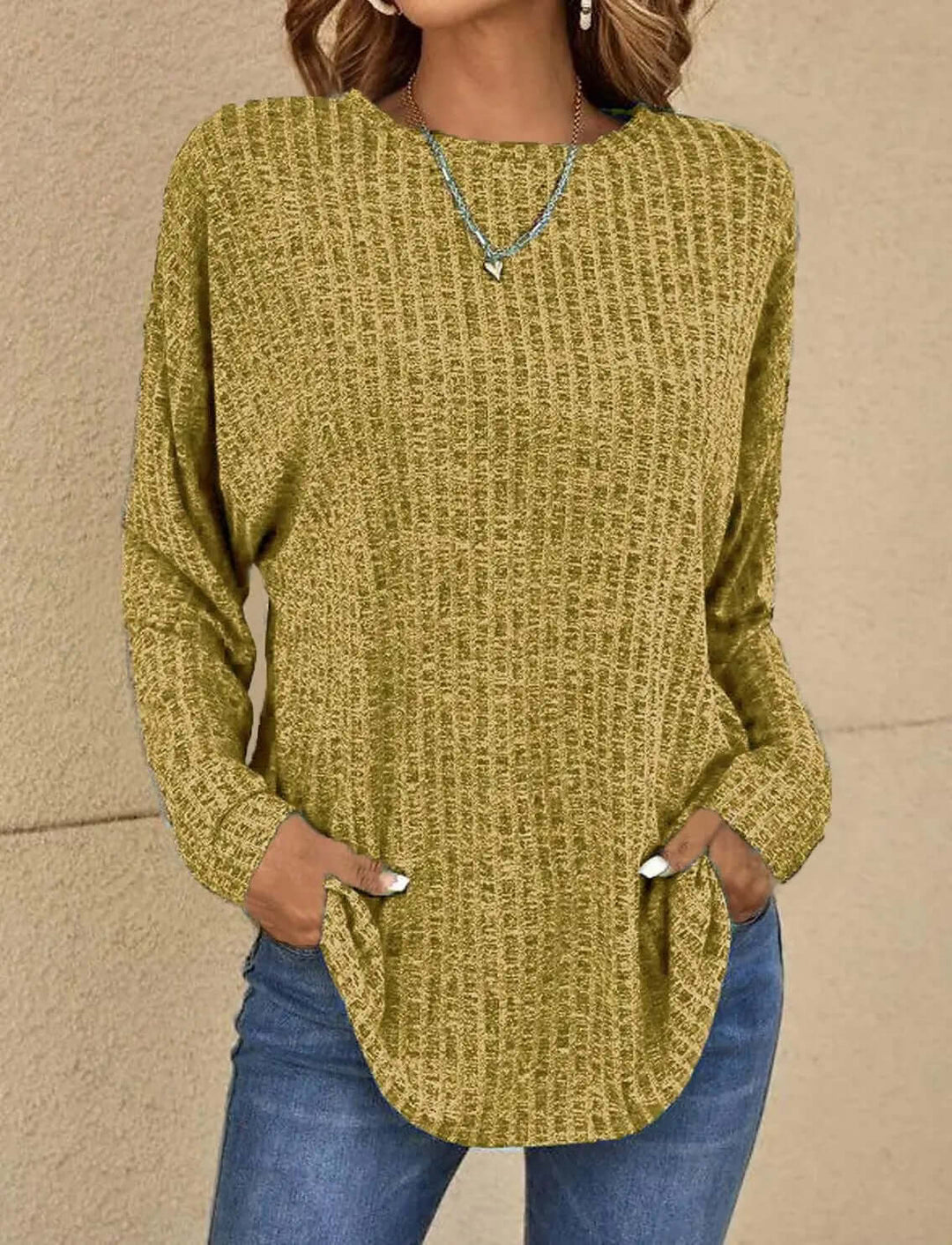 Soft knit women's top with long sleeves. Stretchy, comfortable fit for stylish, casual everyday outfits.