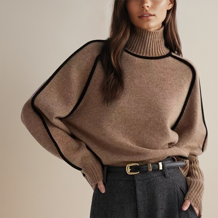 Cozy women's turtleneck sweater with relaxed fit, elegant long sleeves, and chic contrast trim.