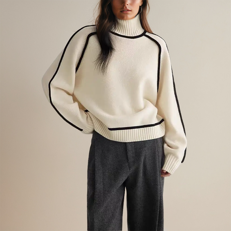 Fashionable women's relaxed fit turtleneck jumper, a cozy top with unique contrast trim for casual chic.