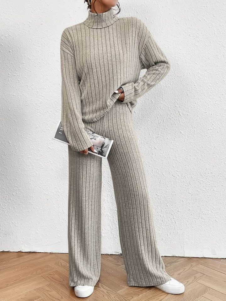 Women's knitted turtleneck sweater and wide-leg pants set, a cozy two-piece loungewear for fall and winter.
