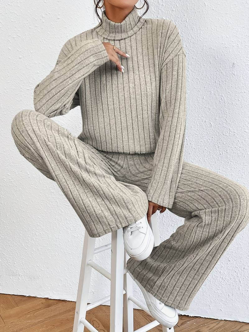 Cozy women's knitted two-piece set featuring a turtleneck sweater and wide-leg pants, ideal for winter fashion.