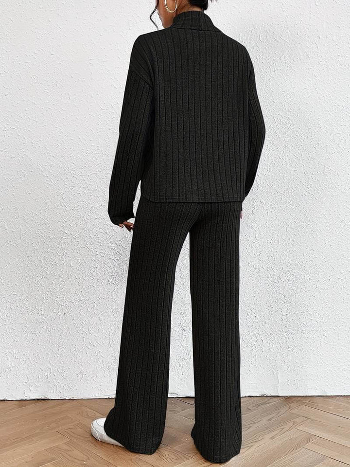 Soft knitted women's set: elegant turtleneck sweater and flowing wide-leg pants for chic, versatile fall outfits.