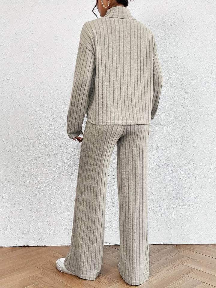 Women's knitted turtleneck sweater and wide-leg pants set, a chic and cozy two-piece outfit for cold weather.