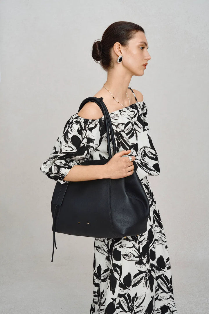 Modern women's large tote bag, a stylish and practical companion for busy days and travel adventures.