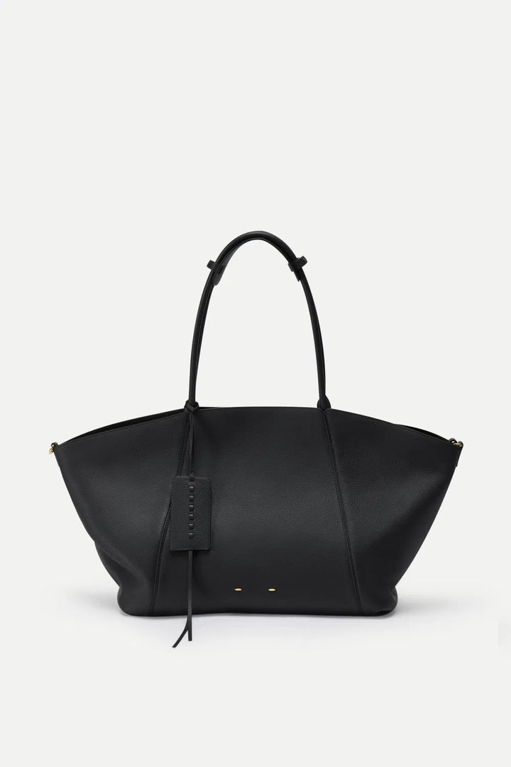 Chic brown women's large tote bag, a spacious & stylish travel essential for the sophisticated woman.