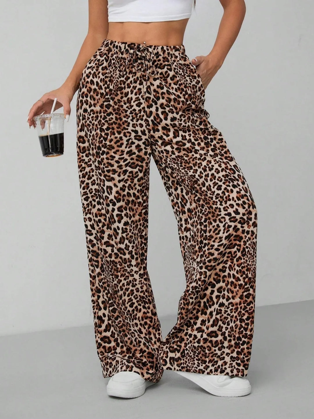 Women's leopard print wide leg pants with a comfy drawstring waist, perfect for casual summer fashion.