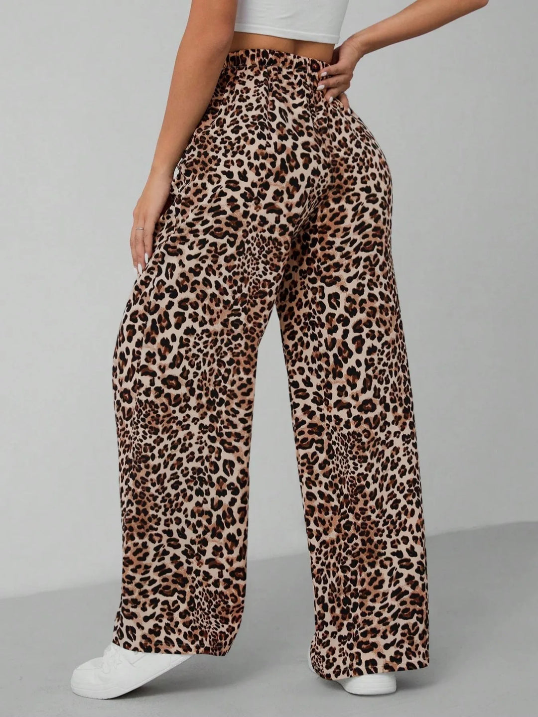 Trendy women's wide leg pants in a stylish leopard print, featuring a relaxed, flowy fit for comfort.