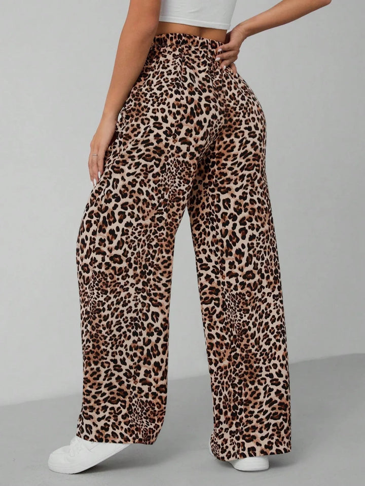 Trendy women's wide leg pants in a stylish leopard print, featuring a relaxed, flowy fit for comfort.
