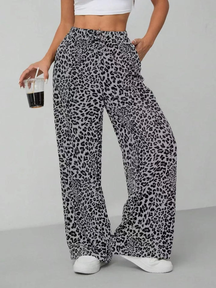 Flowy, comfortable women's pants with a chic animal print. These wide leg leopard print pants are summer-ready.