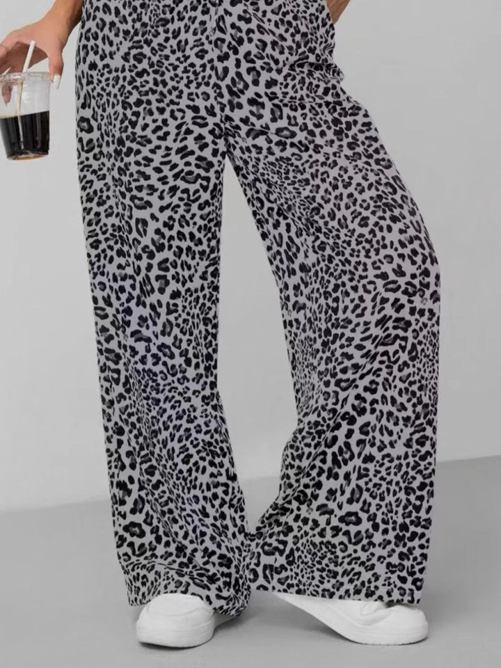 Trendy women's fashion: relaxed fit wide leg pants in a bold leopard print, great for stylish casual wear.