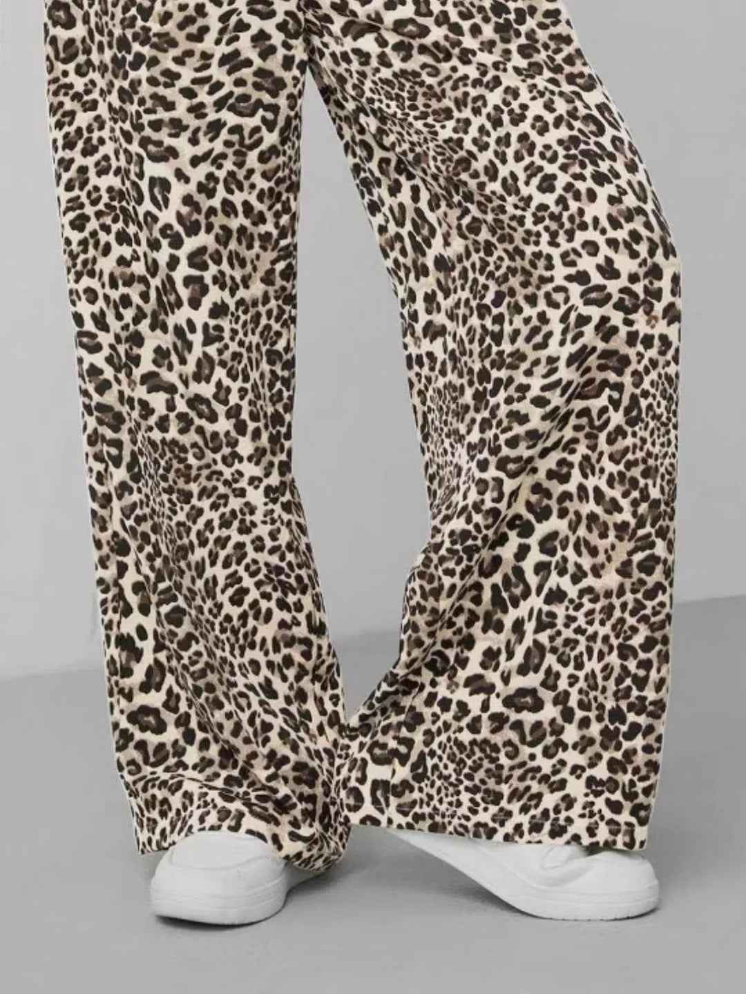 Women's animal print wide leg pants with a comfortable drawstring waist. Leopard print for a trendy, relaxed fit.