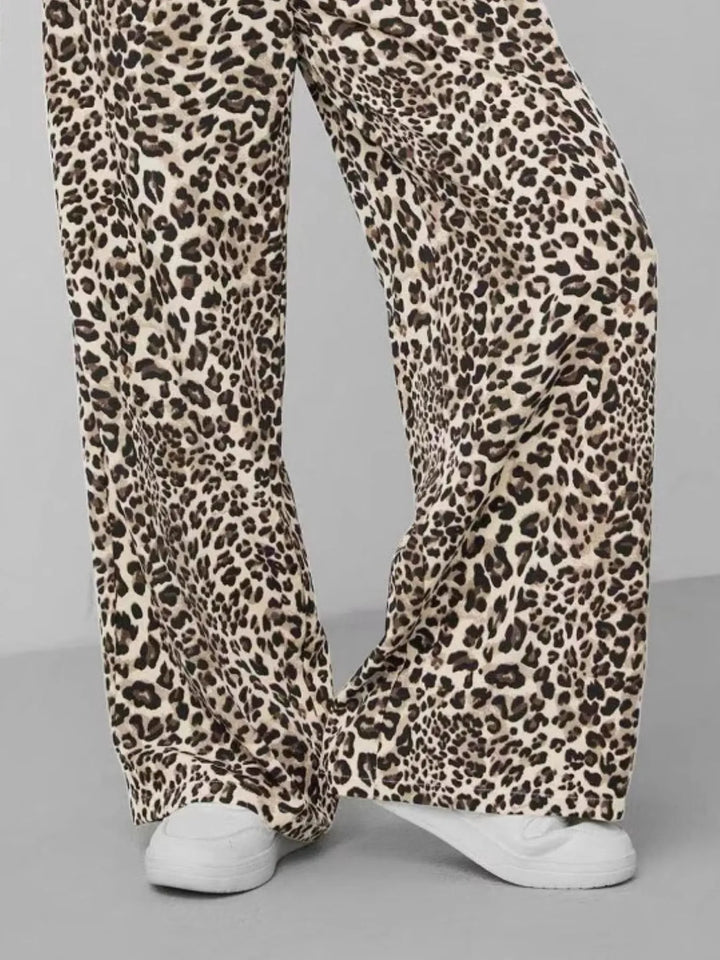 Women's animal print wide leg pants with a comfortable drawstring waist. Leopard print for a trendy, relaxed fit.