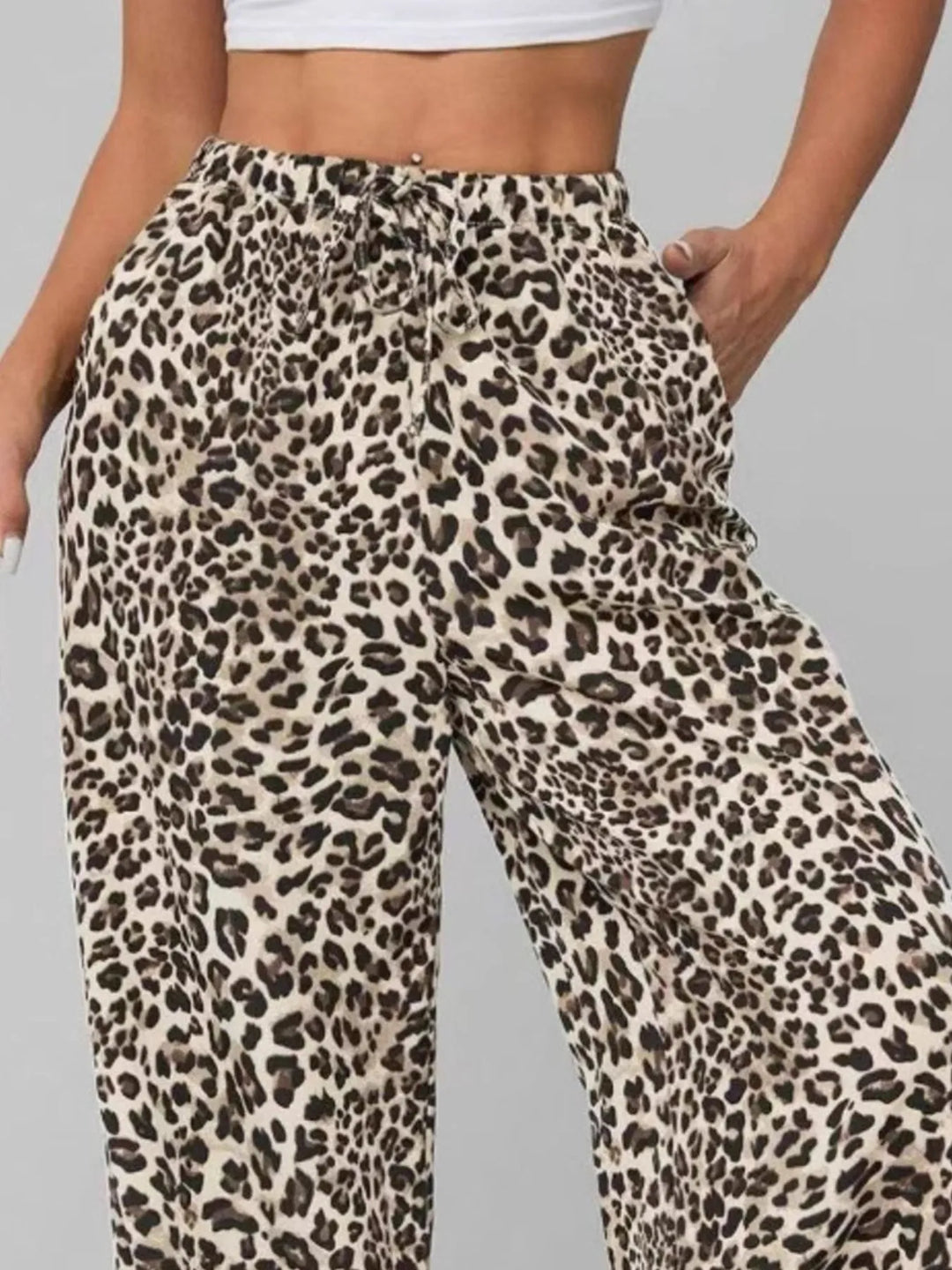 Stylish women's leopard print wide leg pants, offering a comfortable, flowy fit for casual or vacation fashion.