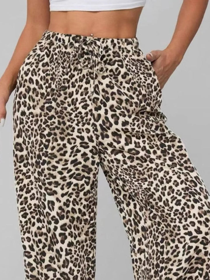 Stylish women's leopard print wide leg pants, offering a comfortable, flowy fit for casual or vacation fashion.