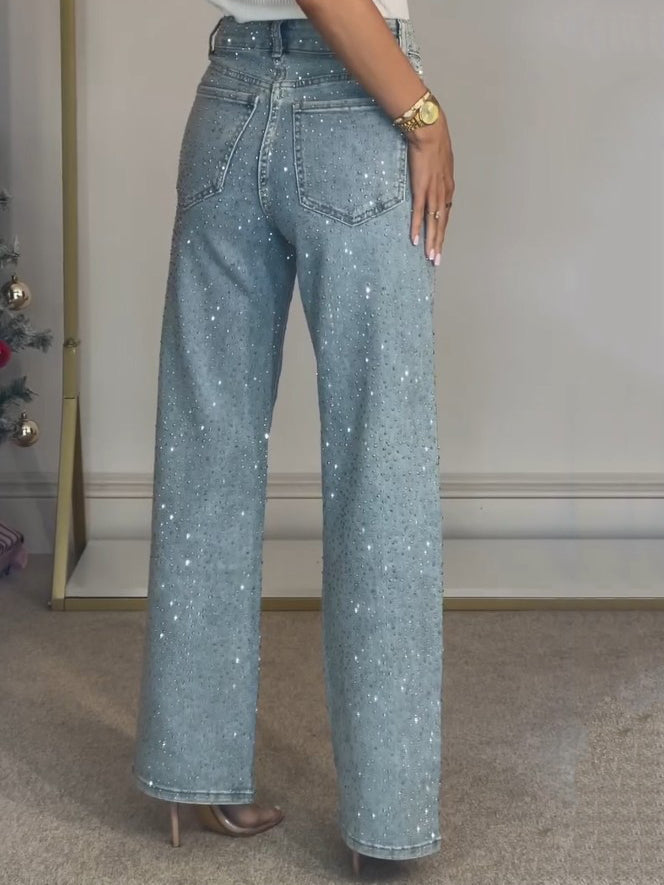 Stylish women's high waist straight leg denim jeans in light blue, featuring elegant diamanté sparkle for a dressy touch.