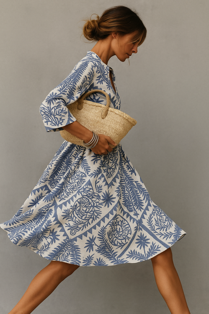 Light blue patterned V-neck boho midi dress for women. Stylish and comfortable summer casual wear.