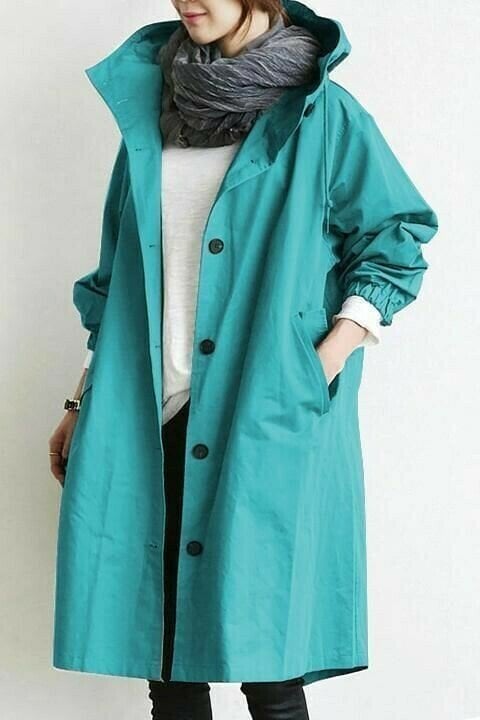 Oversized women's Aurora windbreaker, hooded, lightweight, stylish outerwear for rainy and windy days.